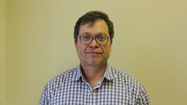 Michael Balikhin looking at the camera with a small smile. 