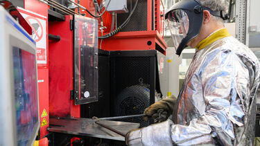 Person in PPE working at the rolling mill
