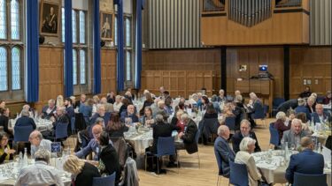 Sheffield will pledgers sitting in round tables enjoying discussions amongst each other.