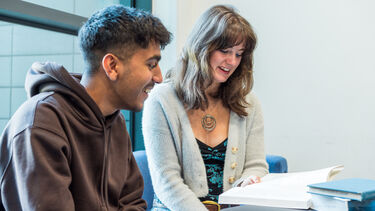 Two students studying at a table