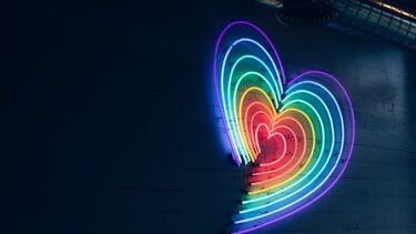 Neon rainbow heart shapes