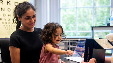 Young girl takes an eye test