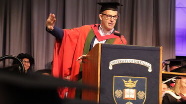 Honorary graduate Martin Lewis at the lecturn