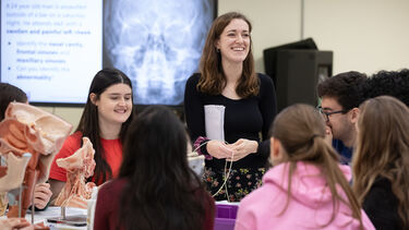 Image of medicine students around a table 