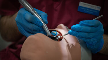 A close up of a student working on a Phantom Head