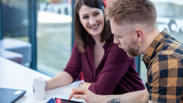 Two people discussing study plan