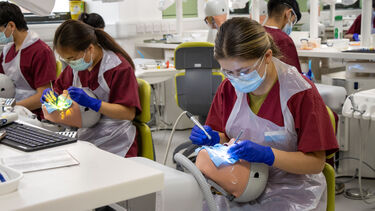 Dentistry student practicing their skills in the Clinical Skills Learning Environment (CSLE)