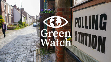 sign outside a polling station with the Green Watch logo overlaid