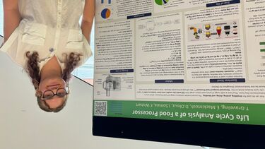 Materials Science and Engineering BEng student Fay in front of her poster presentation