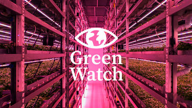 A corridor in a vertical farm warehouse with the Green Watch logo overlaid 