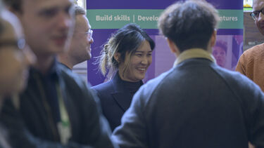 people smiling in room talking