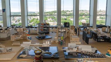 An array of wooden architectural models on display in the Arts Tower