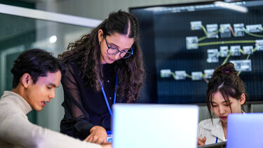 Group looks at a computer