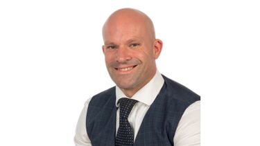 An image of a smiling man, Dr Dan Pope