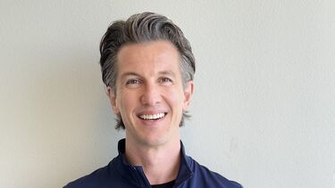 White man smiling at camera