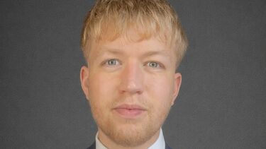 Student Brogan Horniman in a suit