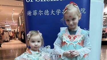 Two girls dressed in traditional Chinese dress 