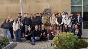 Students and alumni outside the AstraZeneca site in Macclesfield