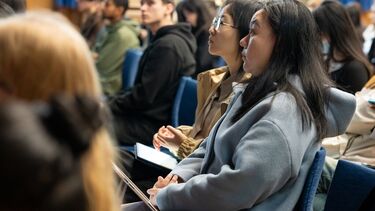 2 students looking up