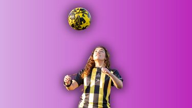 A female football playing heading a football superimposed on a pink background