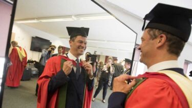 A man in graduation robes