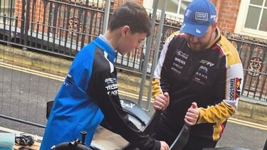 Young racer visits campus