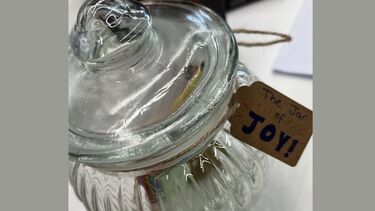 Photograph of a clear glass jar with the label  'Jar of Joy'