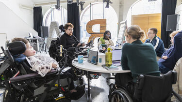 The theatre collaborator team sat round a table doing research and development