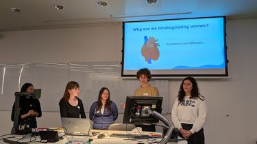 Photo of engineering students giving a group presentation