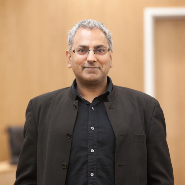 Profile picture of A head and shoulders photo of Kamal Birdi stood in the Middleton Lecture Theatre.