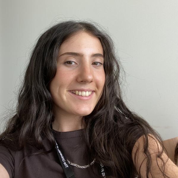 Profile picture of A selfie of a Caucasian woman with long brown hair against a white background 