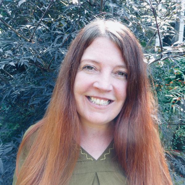 Profile picture of  Liz Chesworth in the garden, smiling 