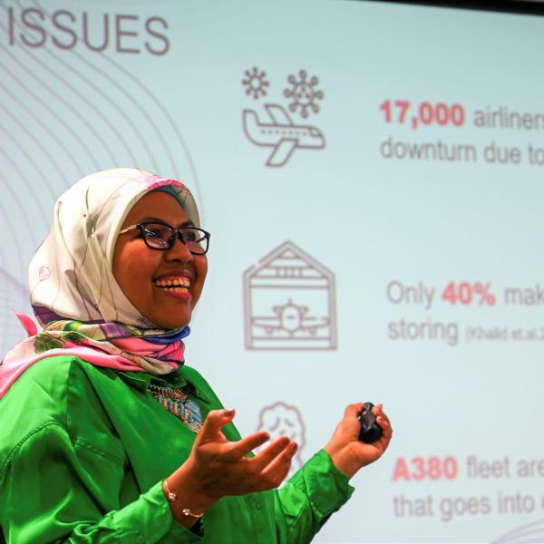 Profile picture of Su Natasha Mohamad delivering a presentation.