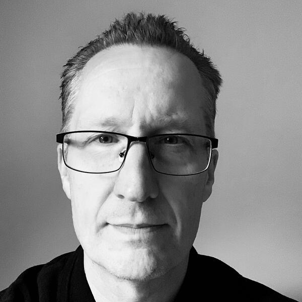 Profile picture of Jamie Butler in black and white 
