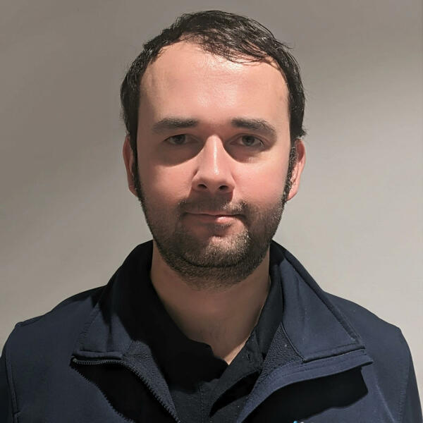 Profile picture of Headshot of male with brown hair and AMRC uniform