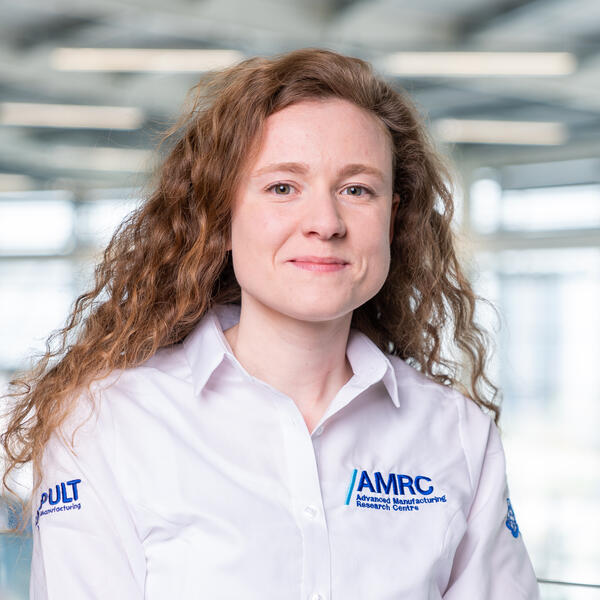 Profile picture of Female with curly hair in white AMRC uniform