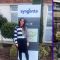 Two pictures of Eleanor, one outside of the Syngenta sign and one smiling in a lab