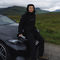 Kaiteng Zhang stood next to a car in the countryside