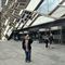A person in front of The Diamond Building