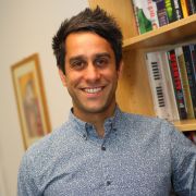 A profile photograph of Dr Jared Ahmad.