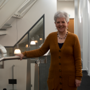 A photograph of Penny Dick on the Management School's mezzanine.