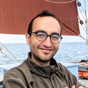 Image of Dr Baris Celik on a boat