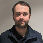 Headshot of male with brown hair and AMRC uniform