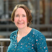 Portrait of academic smiling wearing colourful top