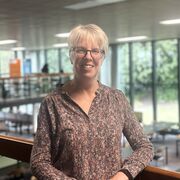Helen stands on the balcony of Western Bank Library