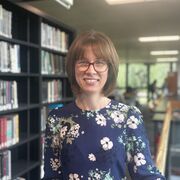 Emily stands in Western Bank Library 