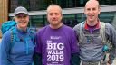 Three members of staff participating in The Big Walk posing outside the Students' Union.