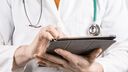 Doctor holding a tablet computer