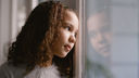 Child looking out of window