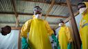 A group of healthcare workers dressed in protective gear